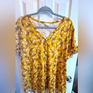 Women’s button down blouse with ruffled sleeves